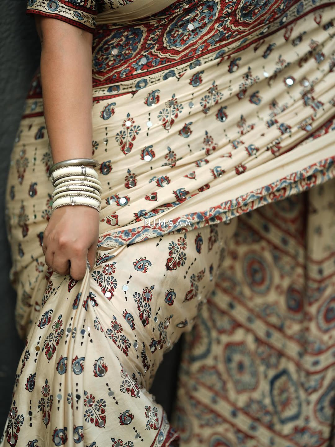 Ivory Modal Silk Ajrakh Printed Saree with Traditional Floral Motifs, Heritage Border & Tassel Detailing